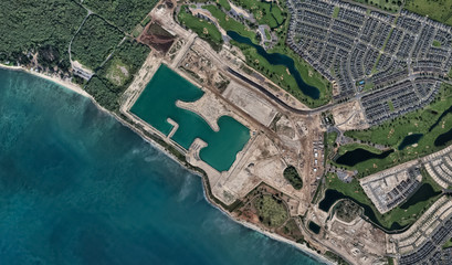Pacific coast and infrastructure of Honolulu Hawaii USA from the height of the drone flight