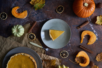 Pumpkin pie with cinnamon and vanilla on a plate.