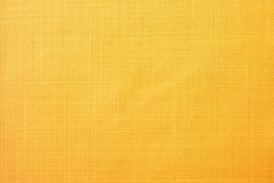 Golden yellow linen fabric of table cloth texture background