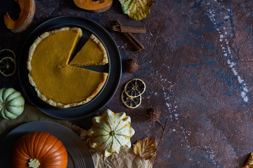 Pumpkin pie with cinnamon and vanilla on a plate.
