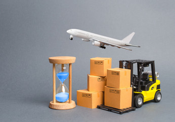 Yellow Forklift truck with cardboard boxesa airmail plane and a sand hourglass. Express delivery...