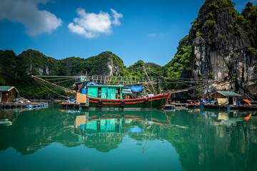 Fototapeta na wymiar Big fishing boat at Vung Vieng floating village in Halong Bay, Vietnam.