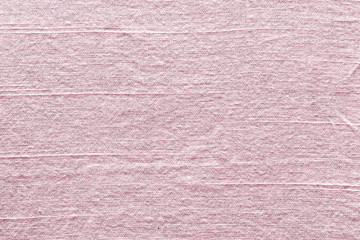 Fototapeta premium Natural pink mulberry paper texture background, handmade fibrous paper with horizontal creases and soft pastel rose tone