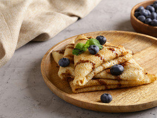 thin pancakes with blueberries for breakfast