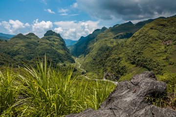 Fototapeta na wymiar Rocky landscape around Du Gia, Ha Giang province, Vietnam. Stunning scenery with limestone karst mountains. 