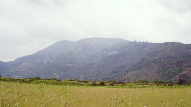 Drone Performing A Flush Flight Over A Field In Ecuador