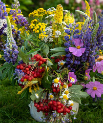 Cheerful bright autumn bouquet of wild and garden flowers