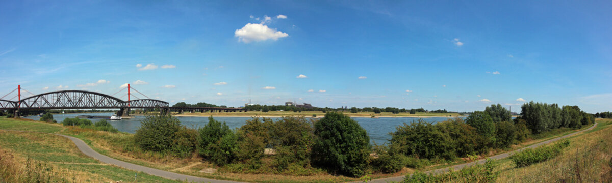 Panoramic view across river Rhein (Germany) near Duisburg