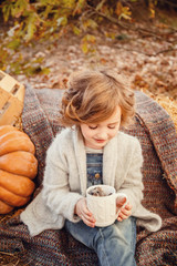 Little hedgehog in the hands of a cute girl