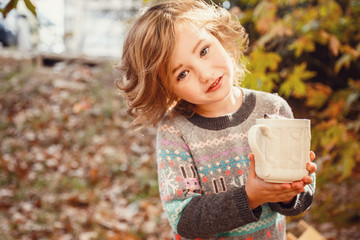 Little hedgehog in the hands of a cute girl