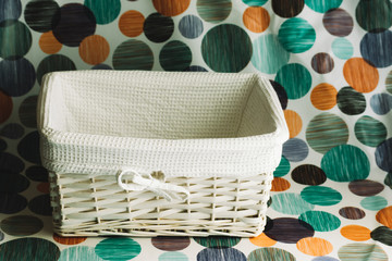 empty white wicker basket with white cloth interior