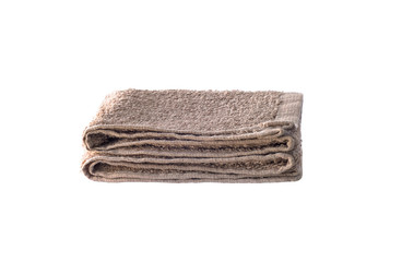 Front view of folded brown towel isolated on white background