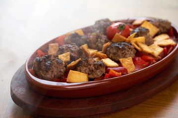 Meatballs in tomato sauce in a frying pan