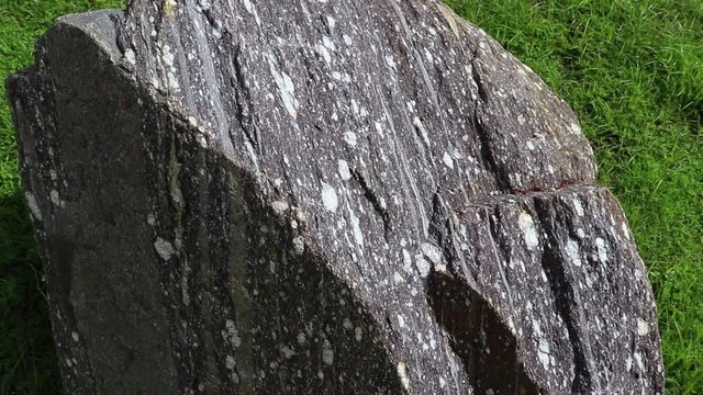 Calcite stone : is a carbonate mineral and the most stable polymorph of calcium carbonate, on ground field.