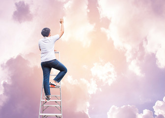 Fototapeta na wymiar Conceptual image of Young man climb up on ladder and raise hand up to the sky, hope concept or christian background human can not go to heaven by their good deed but by the grace of God, copy space