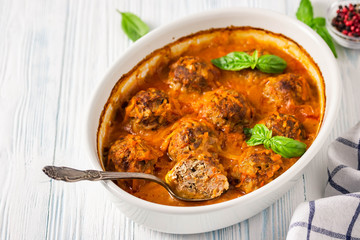 Turkey meatballs in a baking dish. Selective focus, space for text.