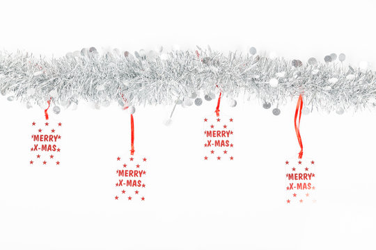 Christmas Silver Garland With Merry Christmas Labels On White Background.