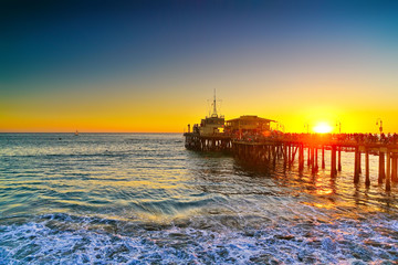 View of Santa Monica Pier on the beach at sunset. - 289133699