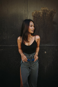 Woman standing in front of a metal door