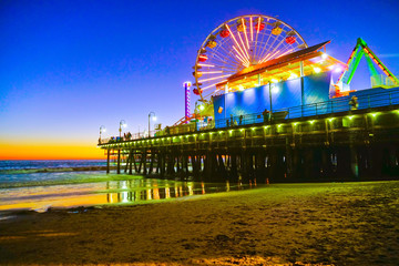 View of Santa Monica Pier on the beach at twilight.