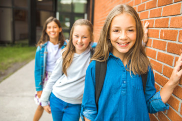 Some nice kids on the school background having fun