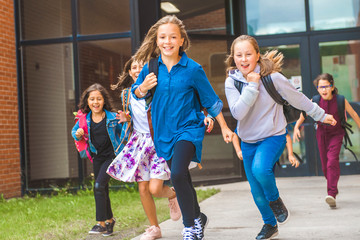 Obraz premium Some nice kids on the school background having fun