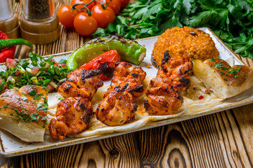 chicken kebab Turkish cuisine on wooden table