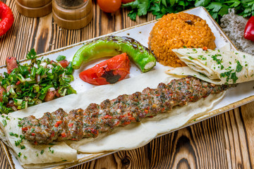 lula kebab from beef and vegetables in Turkish on the board