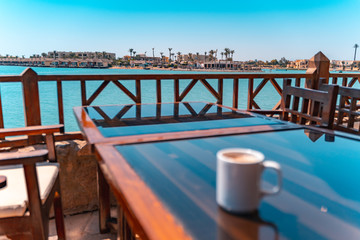 blurry Coffee in front of a lagoon El Gouna beach, Red Sea, Egypt