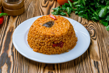 bulgur with vegetables Turkish cuisine on wooden table