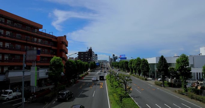 A downtown street at Kanpachi avenue in Tokyo daytime wide shot