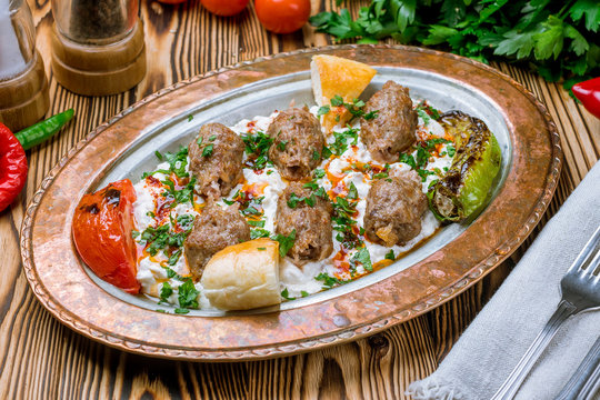 Ali Nazik Turkish cuisine on wooden table