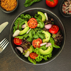 salad healthy, vegetables (avocado, tomato, mix leaves, arugula, lettuce, onions and more) top menu concept. food background. copy space