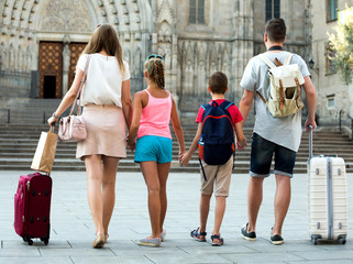 Back view of family with kids who are travelling together
