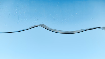 wavy water on blue background with droplets