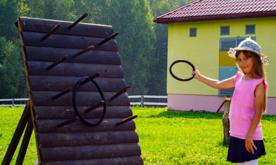 child 6-7 years old plays in the park