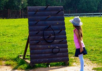 child 6-7 years old plays in the park
