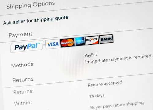 Photo of a Apple iPad device showing online shopping process via Paypal, using popular banking systems Visa, Mastercard and other.