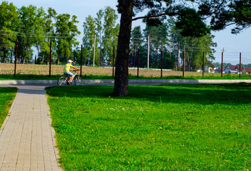 child 6-7 years old plays in the park