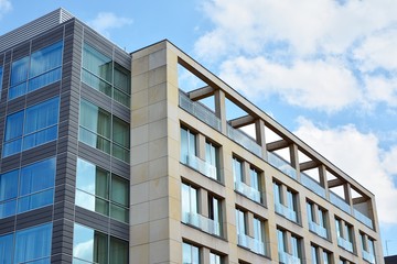 The windows of a modern building for offices. Business buildings architecture.