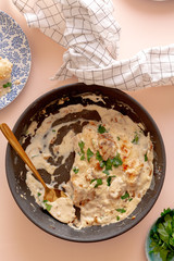 Creamy mushroom chicken in pan. top view