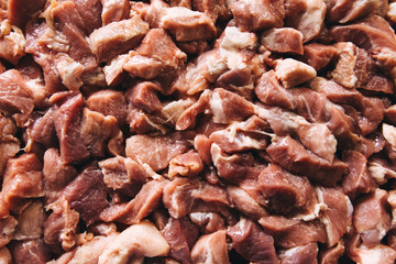 Heap of raw diced beef meat isolated, top view