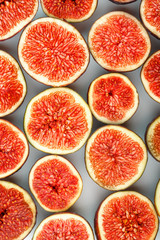 Figs are ripe. Creative diagram of chopped figs on a white background in the form of a texture inscribed in a rectangle. Soft contrast