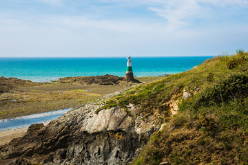 Pléneuf-Val-André Lighthouse with Turquoise Blue Atlamtic Ocean on a Sunny Summer Day in Brittany France