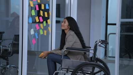 Business concepts. The disabled girl is writing an attitude to comment on the office. 4k Resolution.