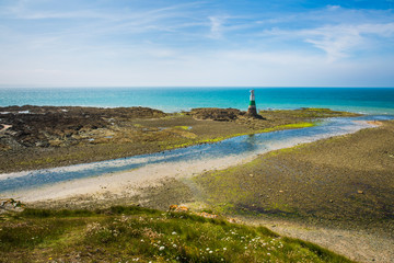 Pléneuf-Val-André Lighthouse with Turquoise Blue Atlamtic Ocean on a Sunny Summer Day in Brittany France