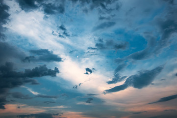 Sunset beautiful sky sun clouds. Moon in the sky.