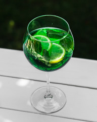 Summer drink. Glass of mojito cocktail with lime and mint. Close-up, bright color.