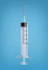 Empty syringe for injection isolated on blue background with clipping path. 3d render illustration
