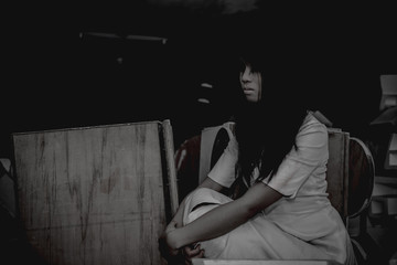 Portrait of asian woman make up ghost face with blood,Horror scene,Scary background,Halloween...